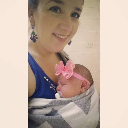My daughter in my Natibaby wrap conversion ring sling (WCRS) at one week old.